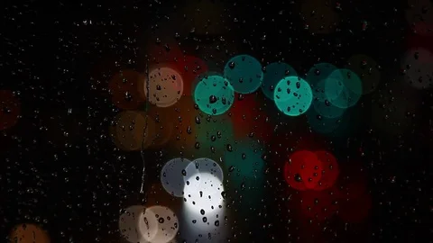 Rainy days,rain drops on the window with traffic bokeh Video stock 69833925