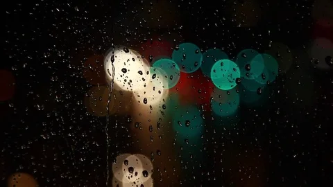 Rainy days,rain drops on the window with traffic bokeh Stock Footage 69835497