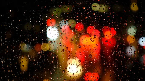 Rainy days.rain falling on the window surface Video stock 166386099