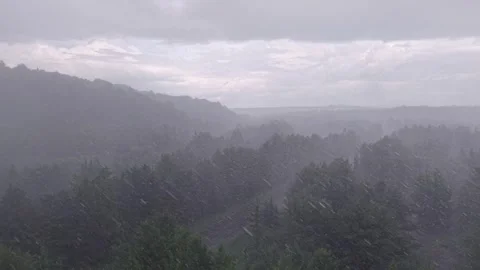 Rainy drone flight over forest and road in Saguenay-Lac-Saint-Jean, Quebec 動画素材 348885218