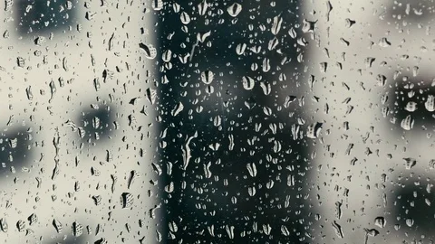 Rainy drops fall on the window closeup view Video stock 73913950