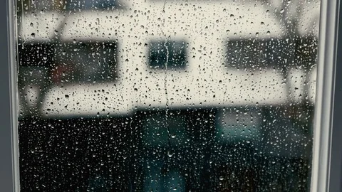Rainy drops rolling on the window closeup view at daylight Video stock 73914852