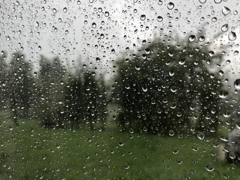 Rainy drops on the window in summer time 스톡 사진