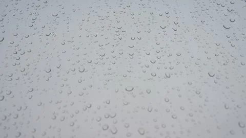 Rainy glass pattern as rain drops lays on a window during a gloomy and Video stock 253967162