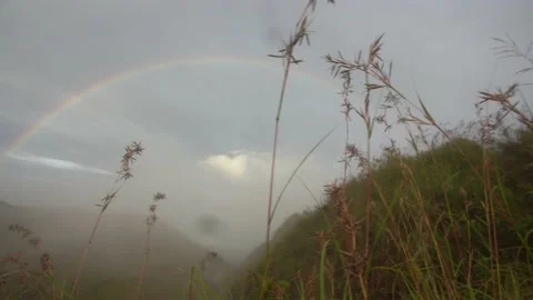Rainy Mist Mountain Top Rainbow in Wet Weather Video stock 143834528