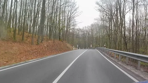 Rainy misty early spring road ride across Tribec low mountain range 動画素材 331957861
