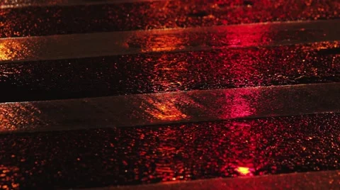 Rainy night in the city. Reflection of traffic lights changing from red to green Stock Footage 63094315