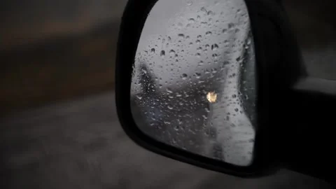 Rainy road view through car side mirror Stock Footage 306322780