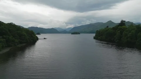 Rainy sky looms over calm, dark waters Vidéo 345527760