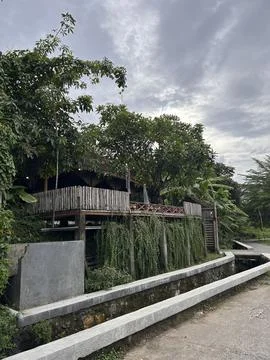 Rainy sky looms over rustic wooden cabin Stock-Fotos