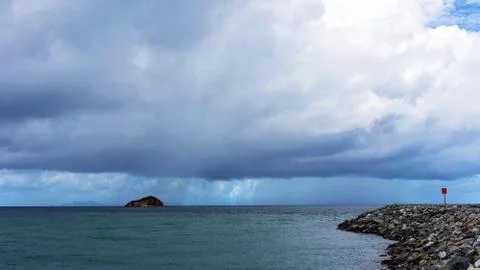 Rainy Sky Over The Ocean Stock Photos