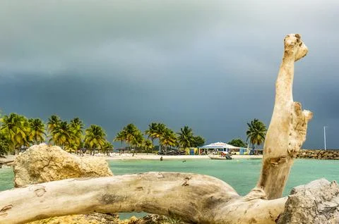 Rainy sky over Pointe de la verdure beach Stock Photos