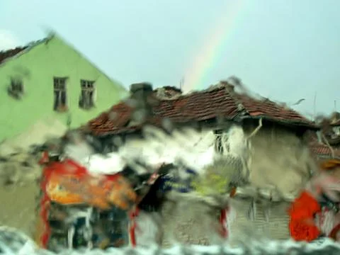 Rainy Sofia with rainbow. - a shot through a wet glass Stock Photos