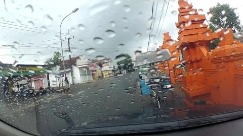 Rainy street view through car windshield Stock Footage 279718059