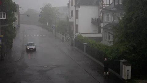 Rainy Streets Dramatic Weather Depicts a Unique Urban Environment with Various Stock Footage 309204986