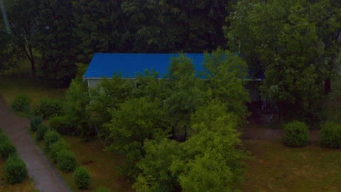 Rainy summer day view through a window. Moody landscape Stock Footage 336898355