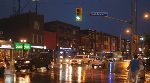 Rainy summer night at Broadview and Danforth, Toronto, Canada. Stock Footage