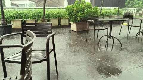 Rainy view in a courtyard where you can eat Stock Footage 274378222