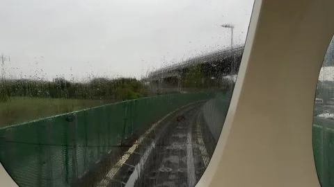 Rainy view through front window of train from airport to city center in Pisa Stock Footage 306959827