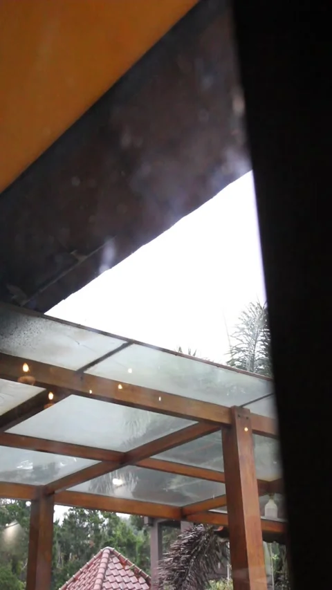Rainy View Through Window of Wooden Structure and Glass Roof Vídeos de archivo 340874458