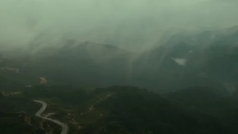 The rainy weather adds a touch of magic to the mountain scenery Stock Footage 237821910