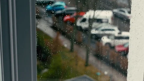 Rainy weather outside with drops on the window pan up Video stock 73913770