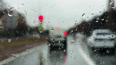 Rainy Weather View Through Car Windshield – Driving in the Rain Concept Stock Footage 306862574