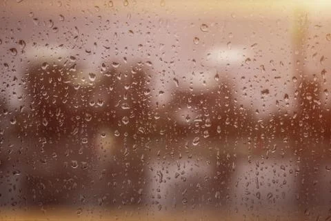 Rainy window in rays of sun texture Foto stock