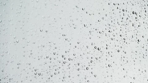 Rainy Window. Tiny droplets cling to glass. 스톡 동영상 323462518