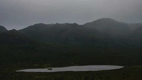 Rainy Yukon mountain range with lake 8K time lapse Stock Footage 111355094