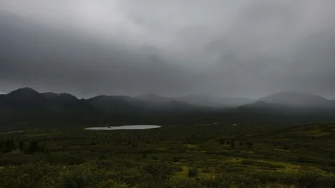 Rainy Yukon mountain range with lake 8K time lapse Stock Footage 111355218