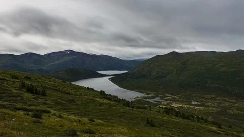 Rainy Yukon mountain range with lake 8K time lapse Stock Footage 111356335