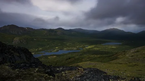 Rainy Yukon mountain range with lake 8K time lapse Stock Footage 111357643