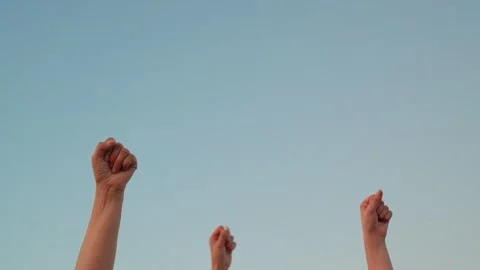 Raise your fist, expression of equality. Teamwork among businesspeople. Group of Stock Footage 318993228