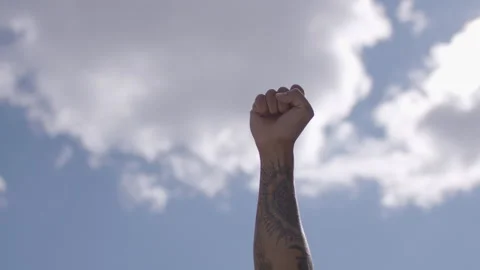 Raised first in solidarity for equality and justice for all. Stock Footage 140464210