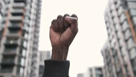 Raised first in solidarity for equality and justice for all. Peaceful protest Stock Footage 147256505