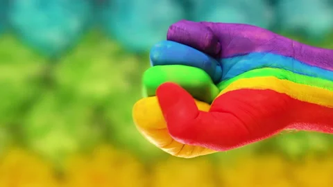 Raised fist patterned with the rainbow Video stock 178548198
