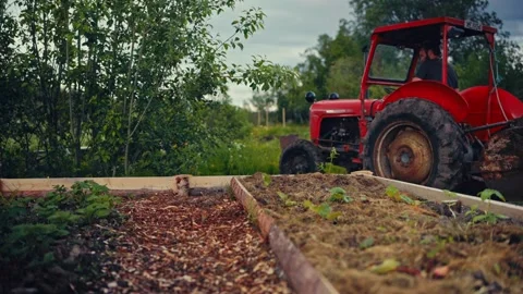 Raised Garden Bed With Tractor In The Background Stock Footage 343082616