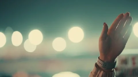 Raised hand points toward lights Stock Footage 336976064