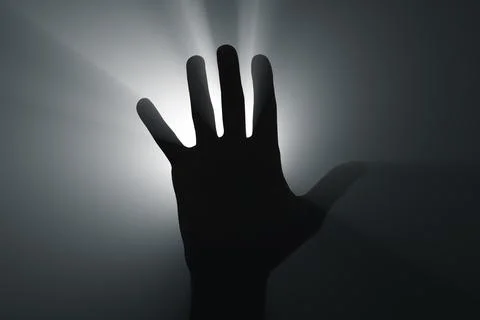 Raised hand in the spotlight. Foto stock