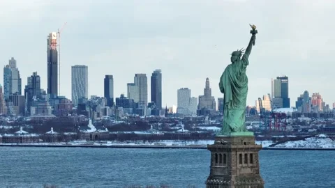 Raised torch of the Statue of Liberty above cold water 動画素材 168155478