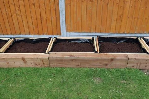 Raised vegetable, flower bed, made with Railway sleepers. Stock Photos