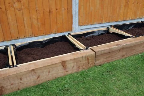 Raised vegetable, flower bed, made with Railway sleepers. Stock Photos