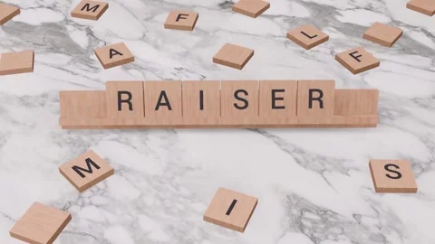 RAISER word written on scrabble Stock Footage 256959586