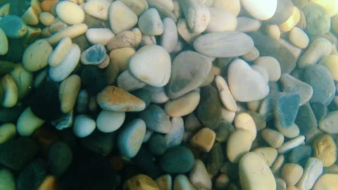 Raises the stones from the bottom of the Video stock 96383733