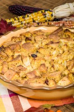 Raisin bread pudding desert with fall decorations Stock Photos