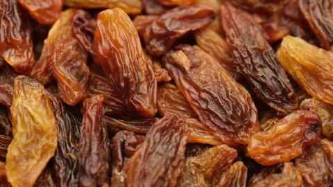 Raisin dried grape berries close up, rotation. Vertical footage Stock Footage 237921080