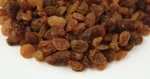 Raisin grains rotating pattern macro texture background Stock Footage 95556500