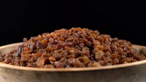 Raisin rotates on a black background Video stock 71534110