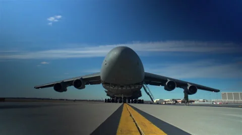 Raising the front cargo door on a C-5 Galaxy Stock Footage 33088427